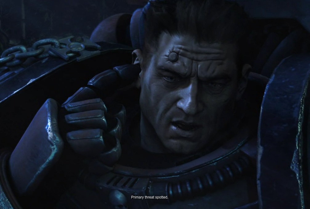 Dawn of War II opening cinematic showing a closeup of a marine's face, with 'primary threat spotted' displayed as subtitles